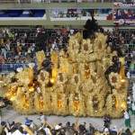 One of the many crazy floats, loaded high with boogying performers hanging on for dear life